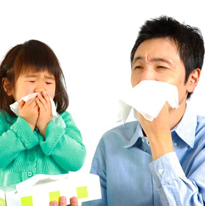 A man and a kid showing symptoms of influenza