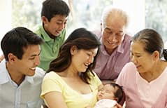 Happy family playing with the baby after immunisation